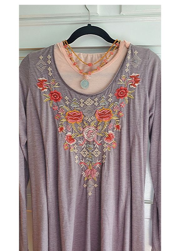 colorful gemstone necklaces in gray tunic